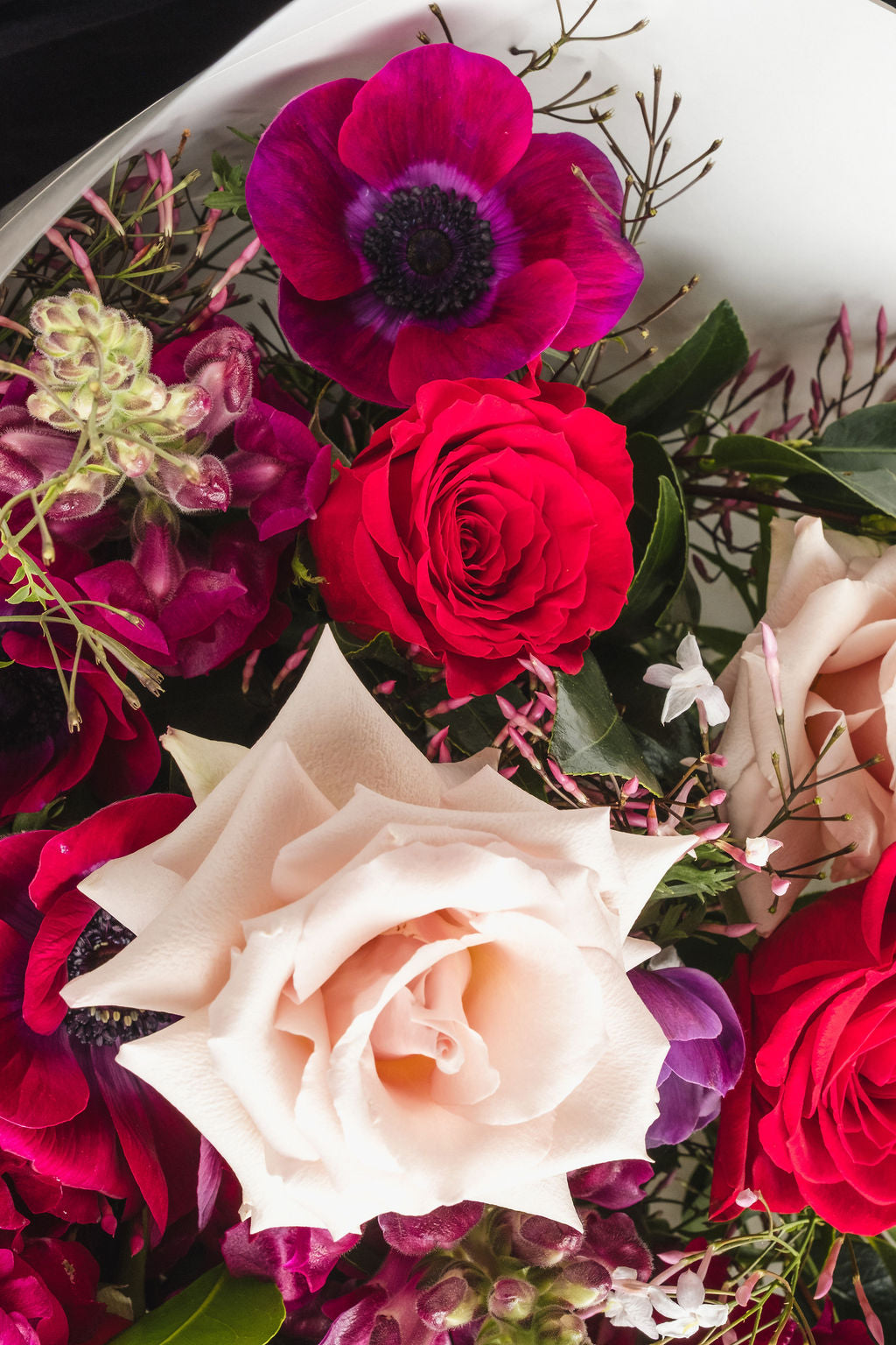 Jewel toned florists choice bouquet