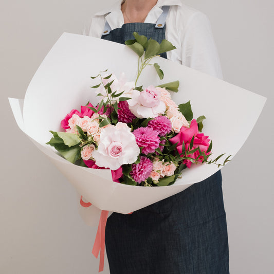 Bright seasonal flowers bouquet with bold and pastel blooms